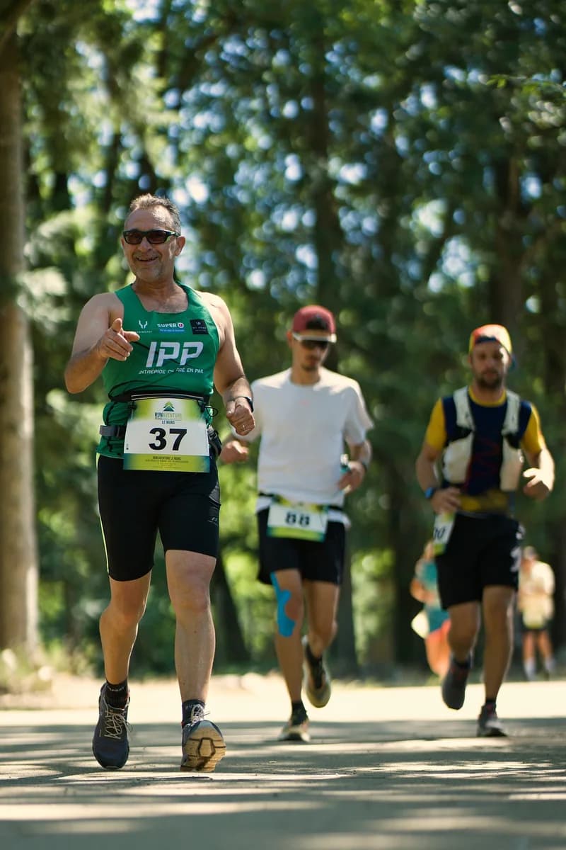 A group of runners on a forest trail, photo processed by Autopilot